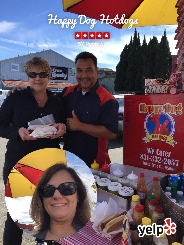 Happy Dog Hotdogs cart and owners serving customers at the Santa Cruz stand
